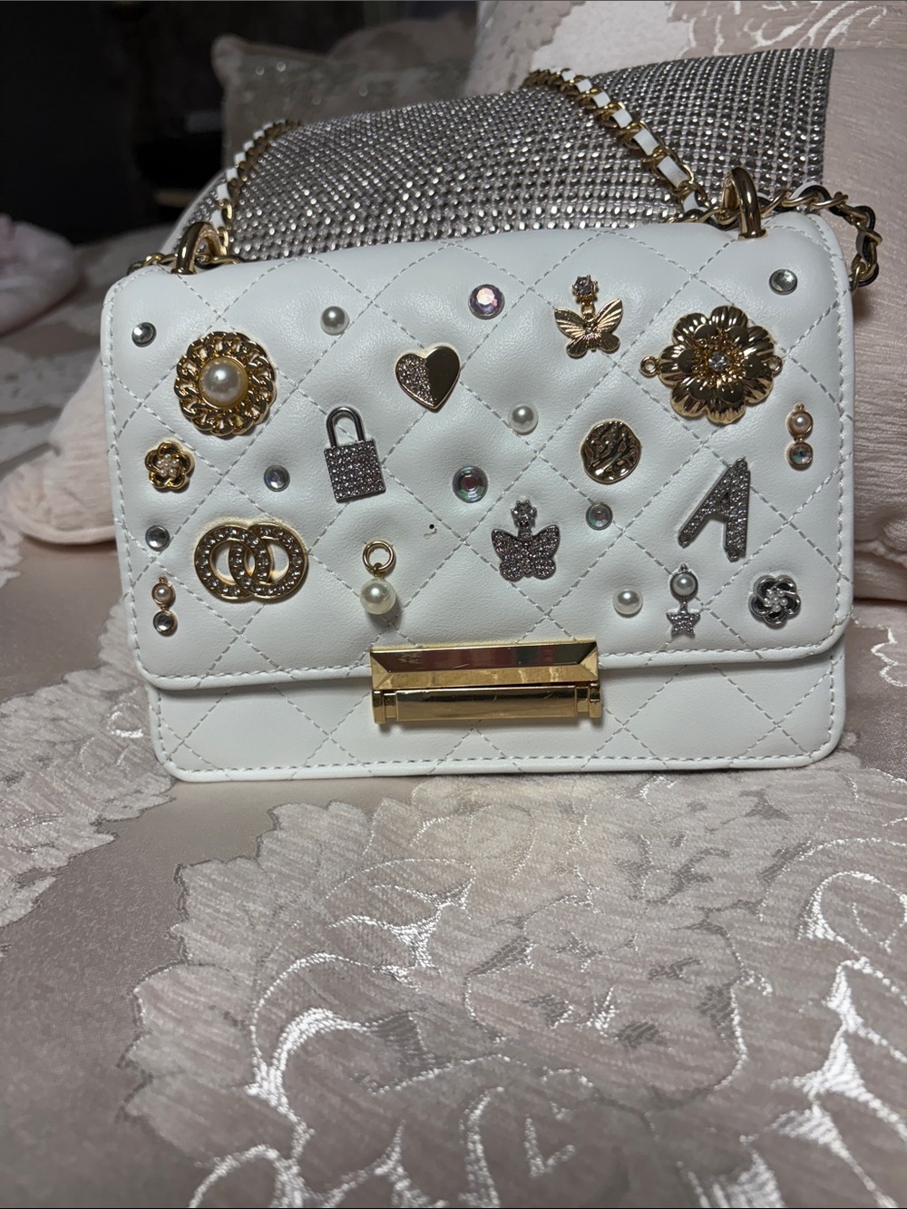 White Quilted Crossbody Bag with Gold Charm Accents